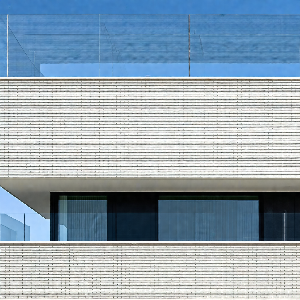 Large white building with a glass balcony