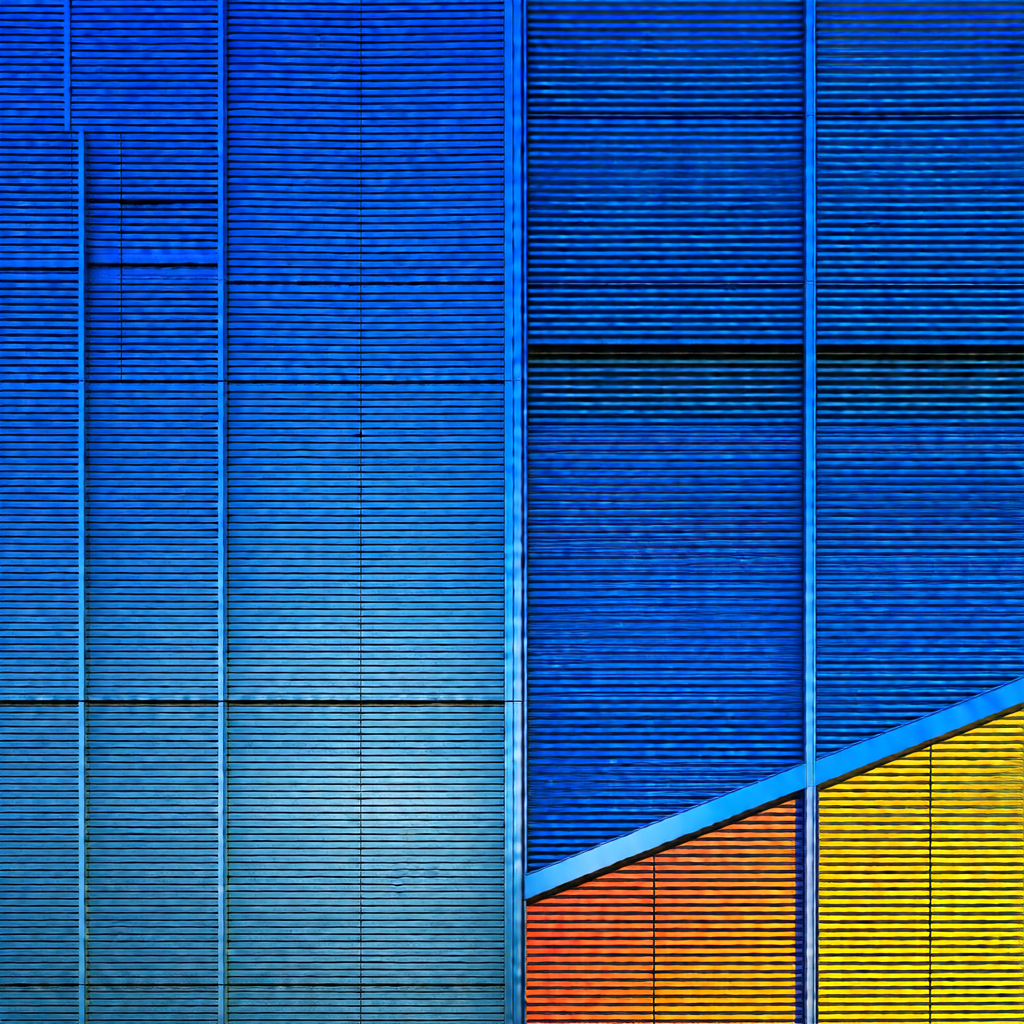 Large blue building with a yellow and orange triangle on ...