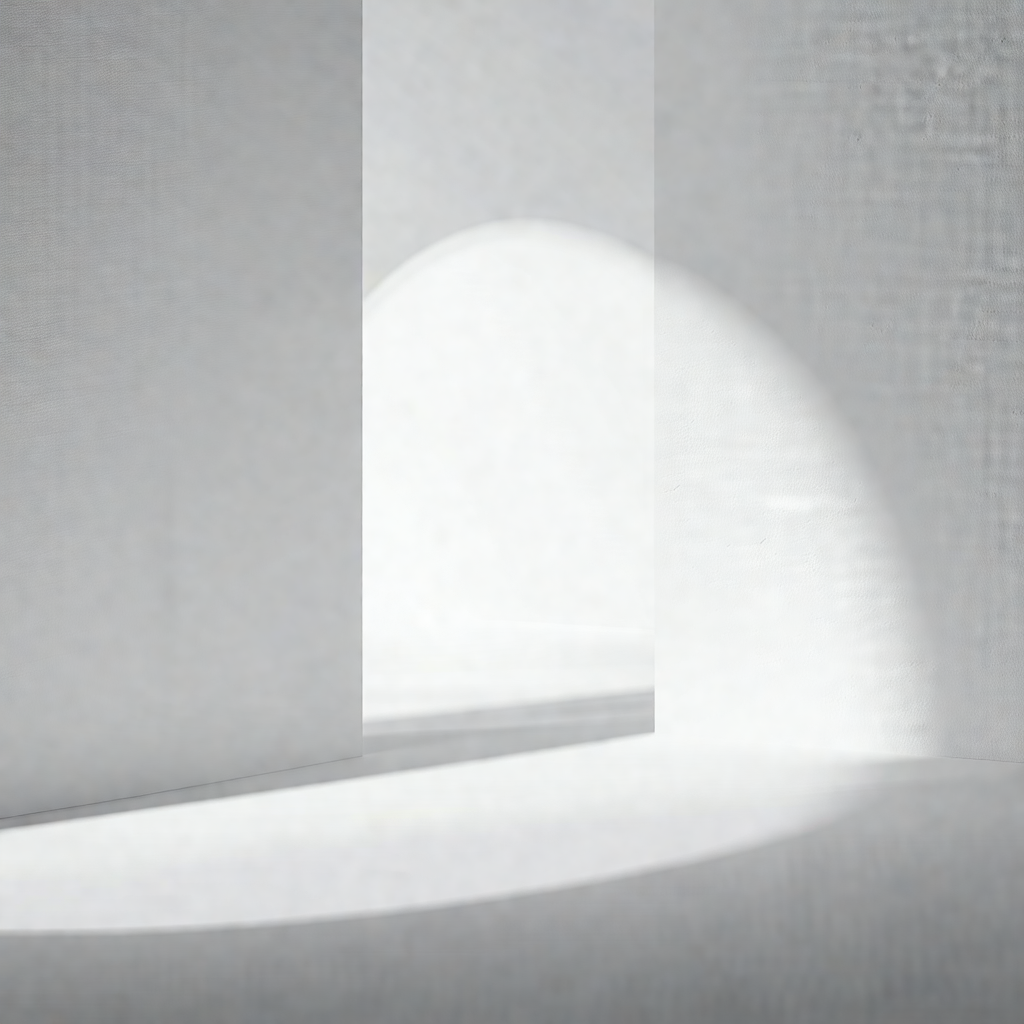 Black and white photograph of a room with a white wall