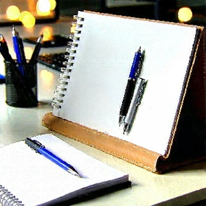 Business Unreal Engine: Workplace with notebooks and pens on desk