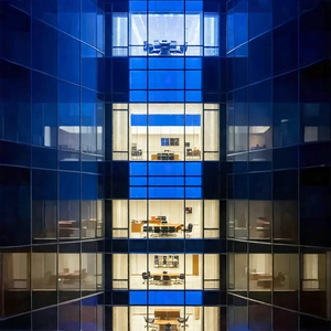 Urban Product Photography: Glass Office Tower With Dramatic Lighting With Large Office