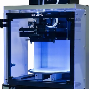 A Large, Blue, And Black Machine With A Clear Glass Front