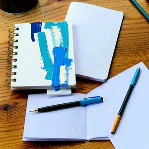 Business Gouache Painting: Workplace with notebooks and pens on desk