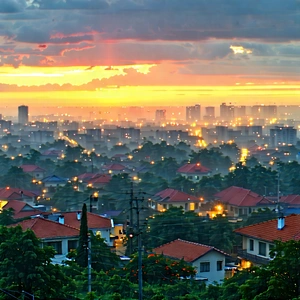 Urban Concept Art: Cityscape Of Small Town During Sunrise With Beautiful Sunset