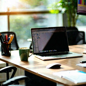 Business Tilt-Shift Photography: Workplace with laptop and coffee on desk