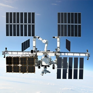 A Space Shuttle With A Large Satellite Attached To Its Side
