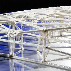 A Large White Structure, Possibly A Bridge Or A Building, With A Blue Background