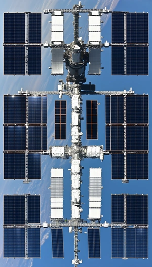 A Large Space Station With A White And Blue Color Scheme