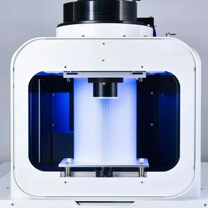 A Large, White, And Blue Machine With A Blue Light On Top