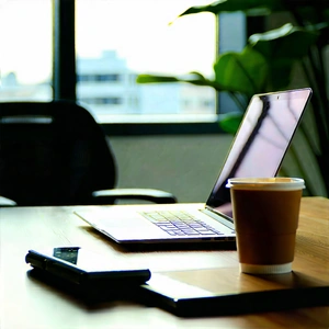 Business Tilt-Shift Photography: Workplace with laptop and coffee on desk