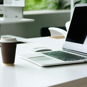 Business Geometric Design: Workplace with laptop and coffee on desk