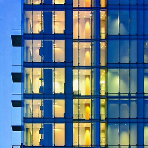 Urban Architectural Photography: Glass Office Tower With Artistic Facade With Tall Building