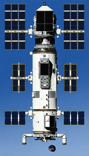 A Large White Space Shuttle Is Docked At The International Space Station