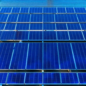 Tech Drone Photography: Solar Panel With Blue Light Glow With Large Blue