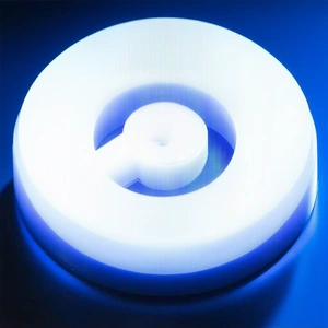 A Blue Background Is Illuminated By A Bright Light, Creating A Glowing Effect