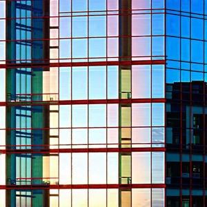 Urban Advertising Photography: Glass Office Tower With Reflective Glass With Large Building
