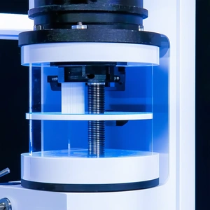 A Clear Glass Container Is Filled With A Blue Liquid