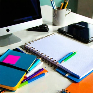 Business Abstract Design: Workplace with notebooks and pens on desk