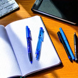 Business Macro Photography: Workplace with notebooks and pens on desk