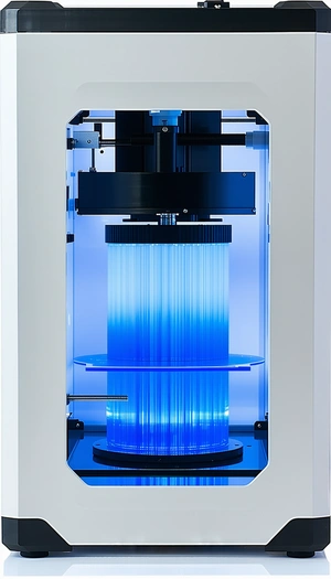 A Blue And White Machine Is Sitting On A Table