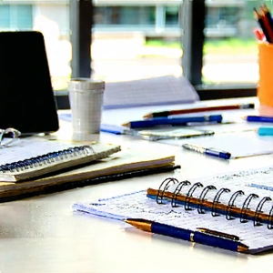 Business Infographic Style: Workplace with notebooks and pens on desk