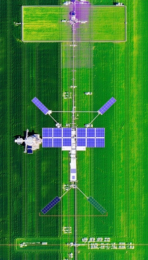 A Large, Green Field With A Solar Panel Array In The Middle