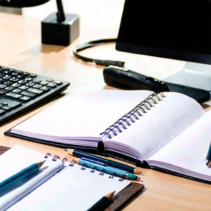 Business Professional Photography: Workplace with notebooks and pens on desk