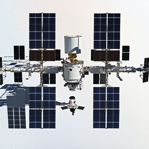 A Space Station Is Shown In A Close-up View, With A Large Satellite Dish On The Side