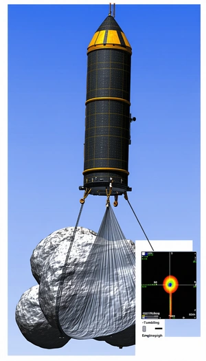 A Large, Black, And Yellow Structure Is Suspended From A Wire, With A Rock Below It