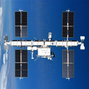 The Image Is A Close-up Of A Space Shuttle, Which Is A Large, White, And Black Spacecraft