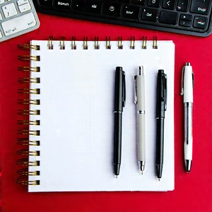 Business Professional Photography: Workplace With Notebooks And Pens On Desk With Desk Variety