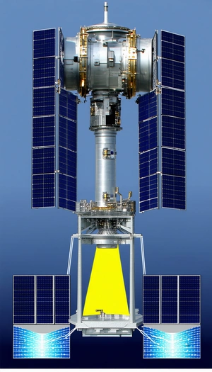 A Large Satellite Dish With A Yellow Light Shining From It