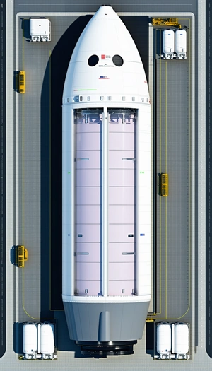 A Large White Rocket Is Being Transported On A Truck