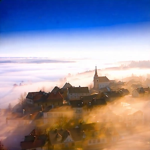 Urban Long Exposure Photography: Cityscape Of Small Town During Foggy Morning With Town Church