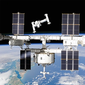 A Space Station With A Large Satellite Attached To It