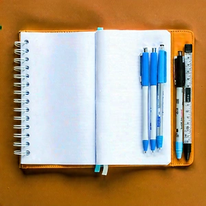 Business Advertising Photography: Workplace With Notebooks And Pens On Desk With Notebook Open