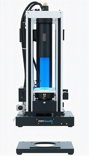 A Large, Black, And Blue Machine With A Blue Light On Top