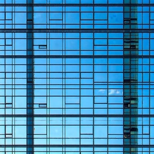Urban Stock Photography: Skyscraper With Reflective Glass With Large Building