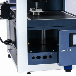 A Blue And White Machine Is Sitting On A White Surface