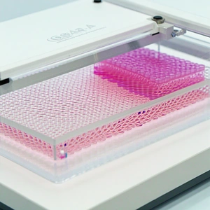 A Machine Is Shown In The Image, Which Is Used For Making Plastic Items