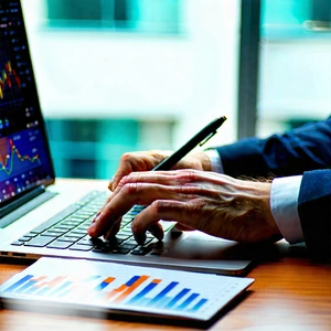 Business Tilt-Shift Photography: Finance professional using laptop