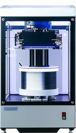 A Large Machine With A Blue Light On Top Of It