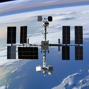 A Space Shuttle With A Large Satellite Dish On Top Of It
