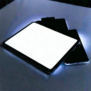 Tablet With Glowing Screen With Table Cell