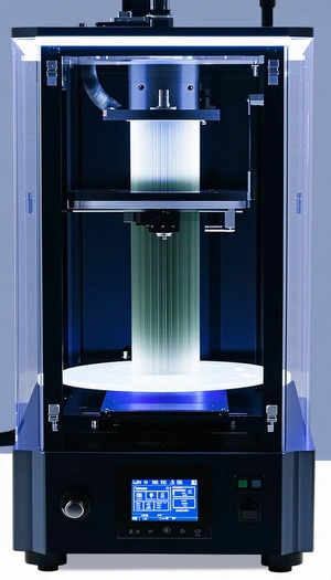 A Large, Blue Machine With A Long, White, Cylindrical Object Inside Of It