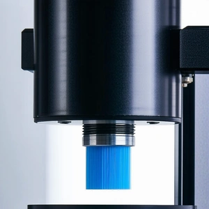 A Microscope With A Blue Filter On It, Capturing A Close-up View Of A Small Object