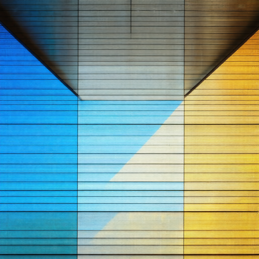 Large building with a blue and yellow striped wall