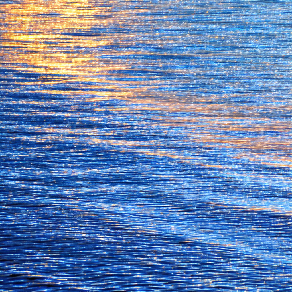 Captures a serene scene of a body of water, possibly a la...