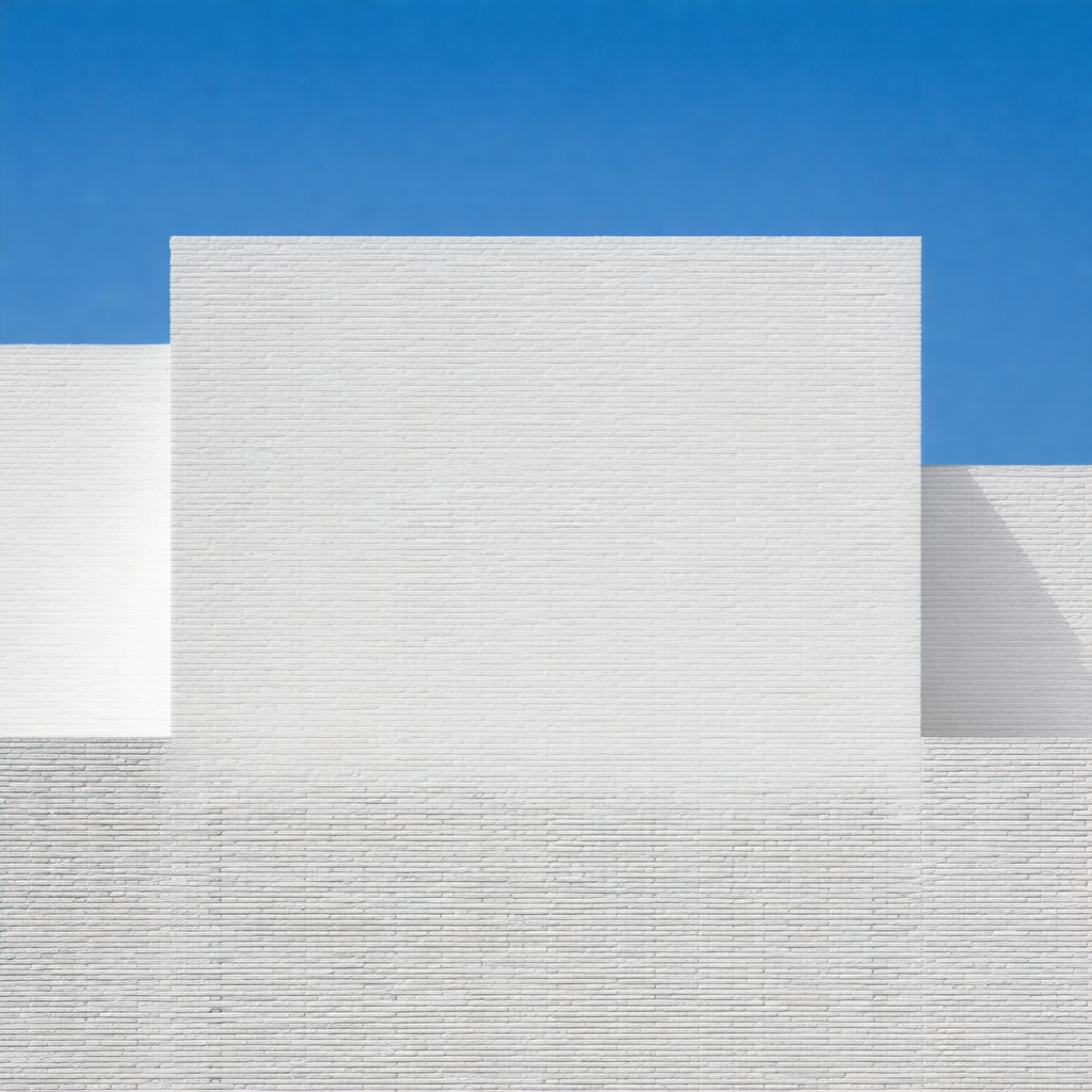 Large white building with a blue sky in the background