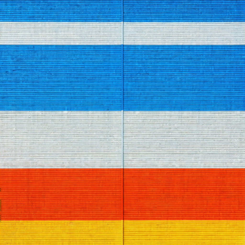 Large, colorful flag hanging on a wall